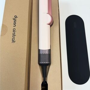Dyson hair styler in pale pink with rose gold accents